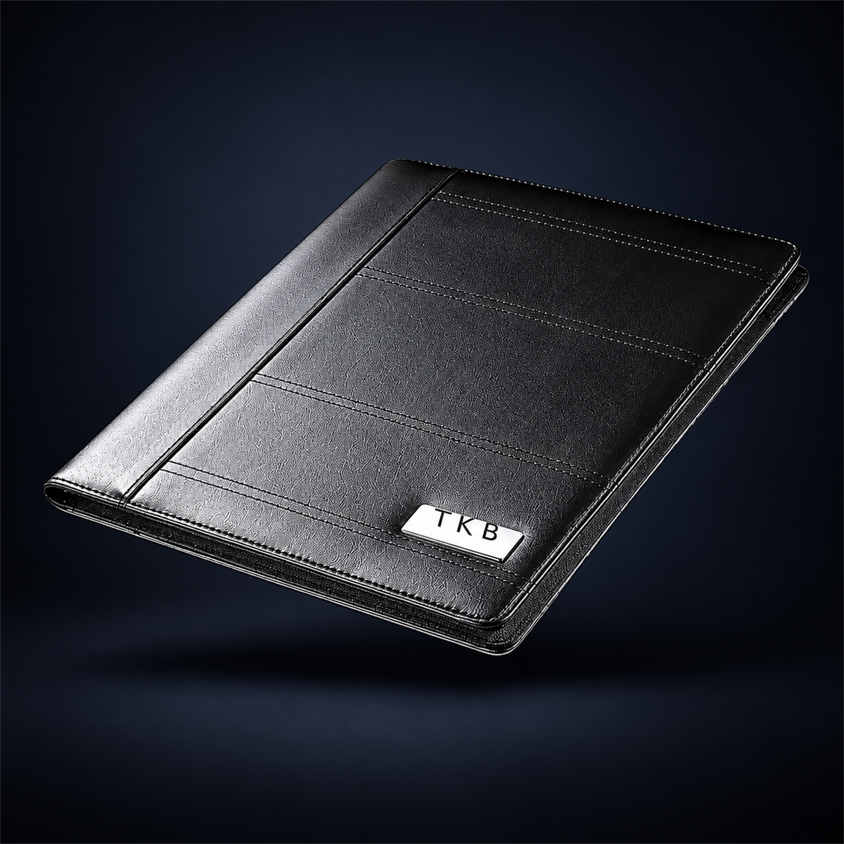 Studio concept image of The Block Folio, a black A4 business folder with a clean textured finish, shown closed on a dark navy background.