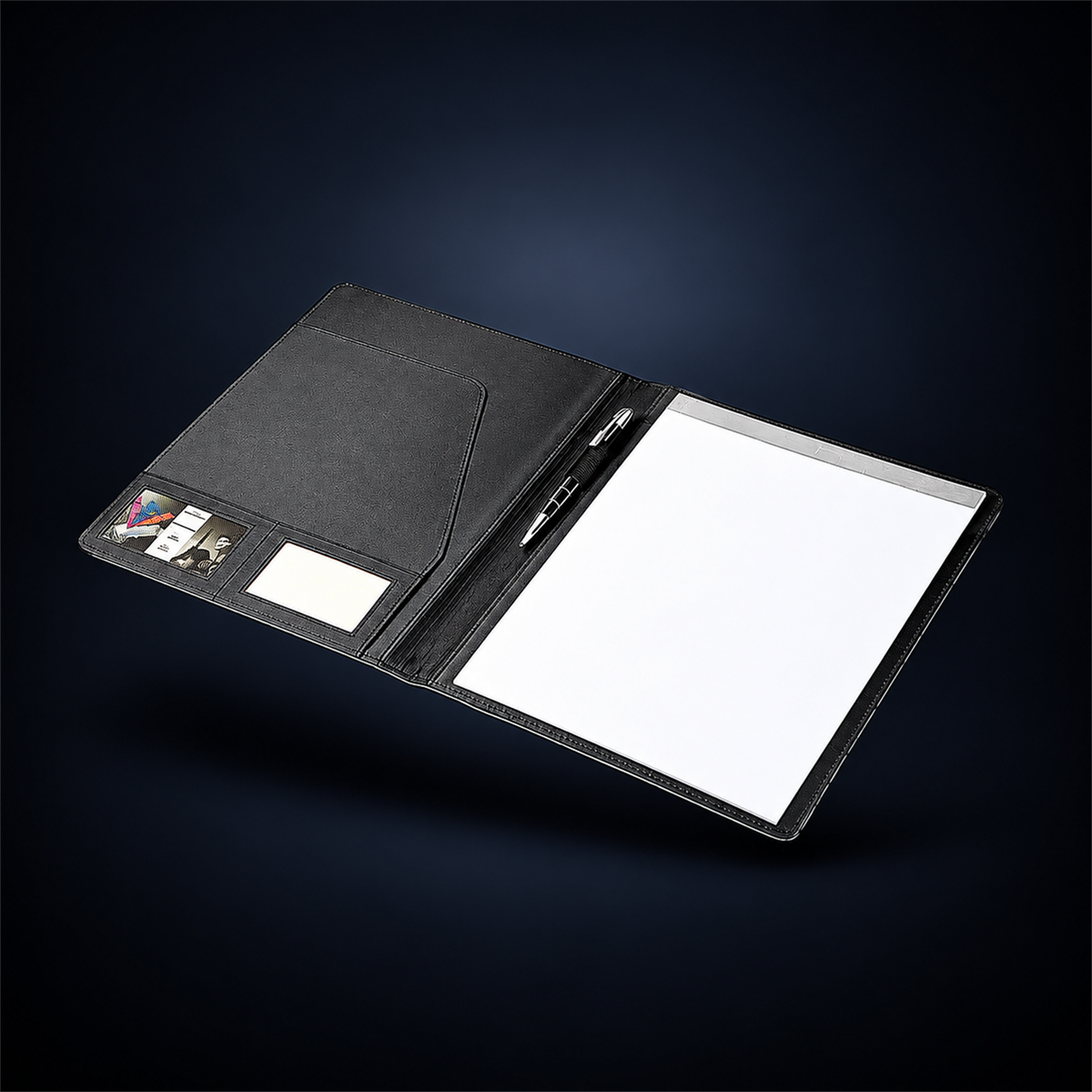 Open studio concept image of The Block Folio showing its document pocket, writing pad and pen loop inside the black A4 business folder.