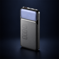 Studio concept image of The Block Power, a compact dark power bank with a front display and top-edge ports, on a dark navy background.