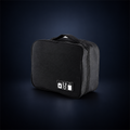 Studio concept image of a compact black zippered tech organiser case with a carry handle and small cable accessory icon patch.